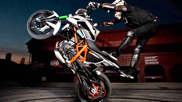 Man motorcycle trick air wheelie free wallpaper for desktop - medium preview image
