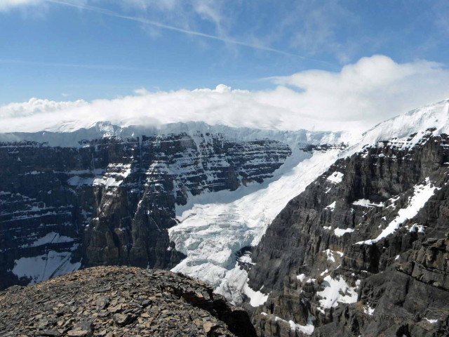 Mountain snow sky clouds person free wallpaper for desktop - medium preview image