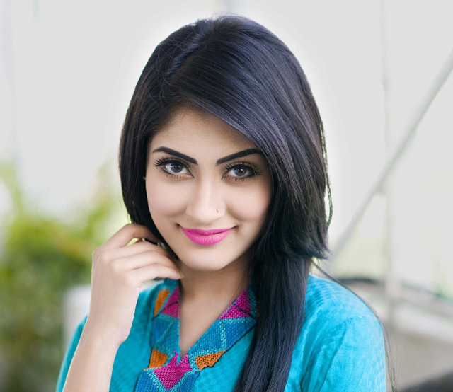 Woman black hair blue shirt free wallpaper for desktop - medium preview image