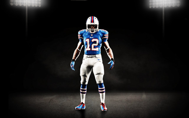 Football player blue uniform spotlight free wallpaper for desktop - medium preview image