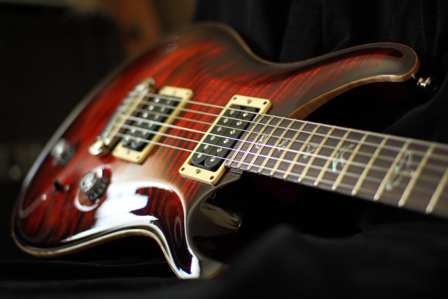 Red electric guitar black background free wallpaper for desktop - medium preview image