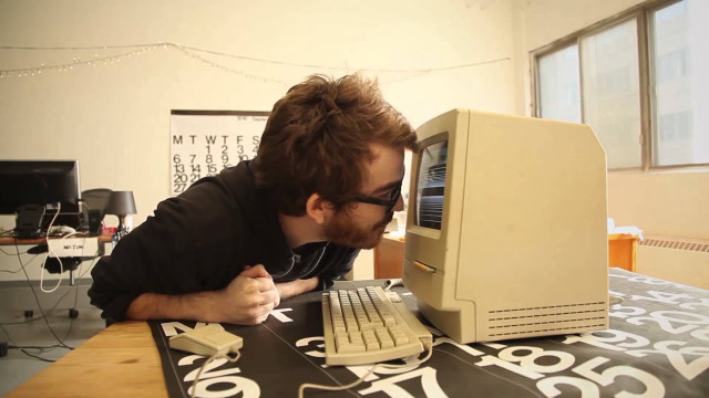 Man leaning computer keyboard mouse free wallpaper for desktop - medium preview image