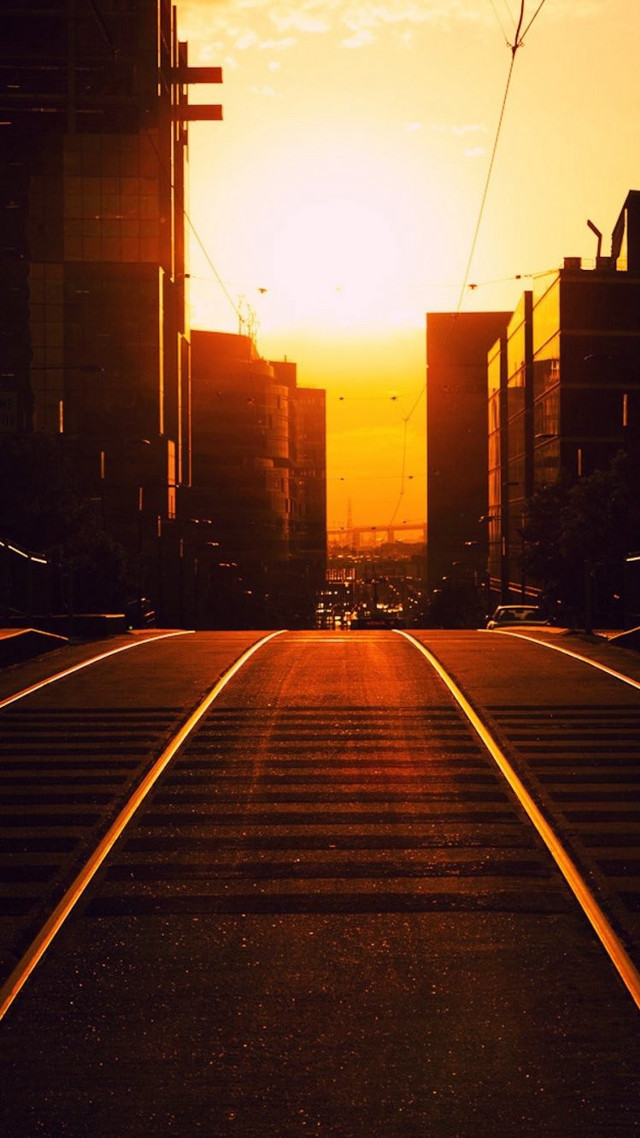 Train track city sunset buildings free wallpaper for mobile - medium preview image