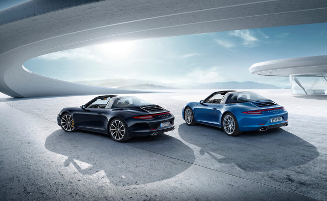 Two blue porsches building sky free wallpaper for desktop - medium preview image