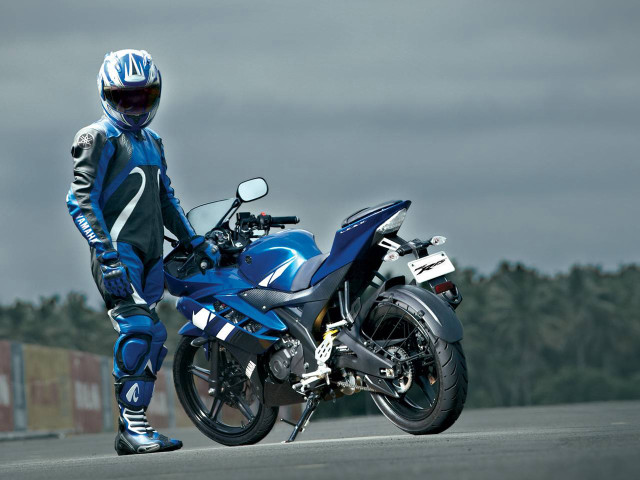Man blue motorcycle suit helmet free wallpaper for desktop - medium preview image