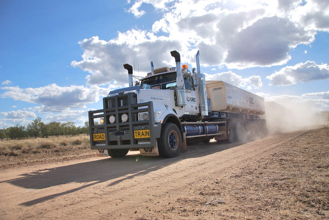 Truck driving dirt road sky free wallpaper for desktop - medium preview image
