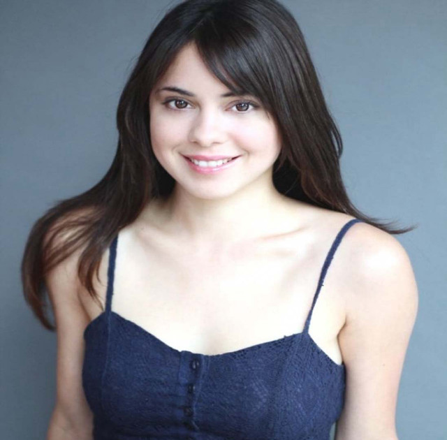 Woman blue top smiling gray free wallpaper for tablet - medium preview image