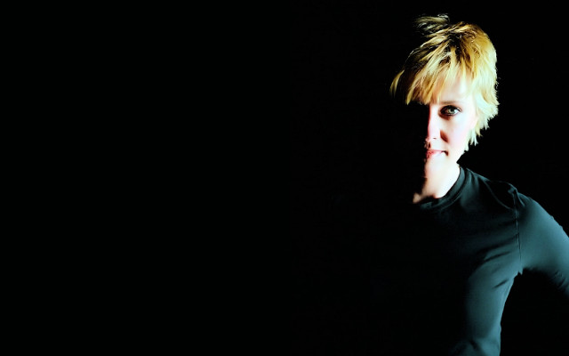 Blonde woman black shirt posing free wallpaper for desktop - medium preview image