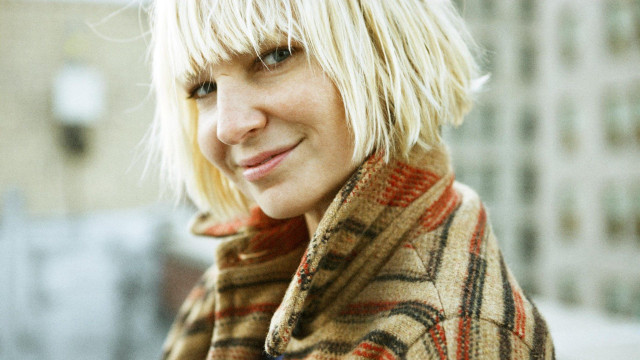 Blonde woman plaid coat smiling free wallpaper for desktop - medium preview image