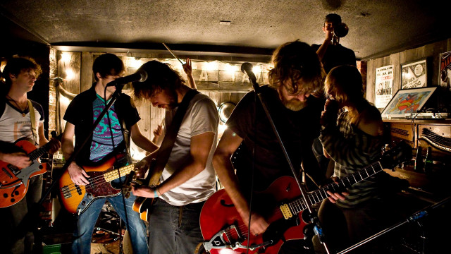 Young men playing guitars room free wallpaper for desktop - medium preview image