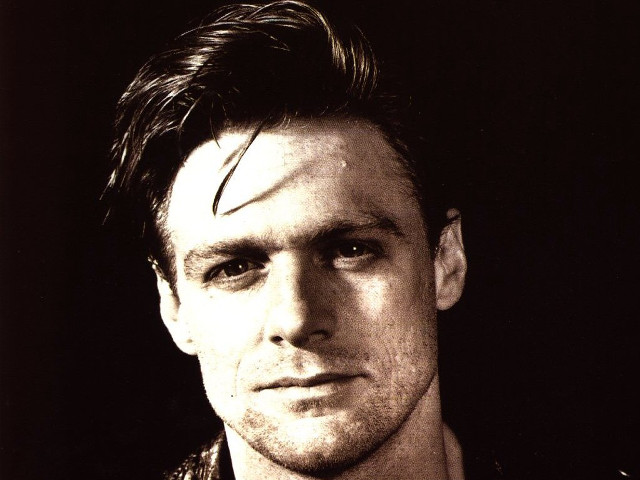 Man goatee leather jacket posing free wallpaper for desktop - medium preview image