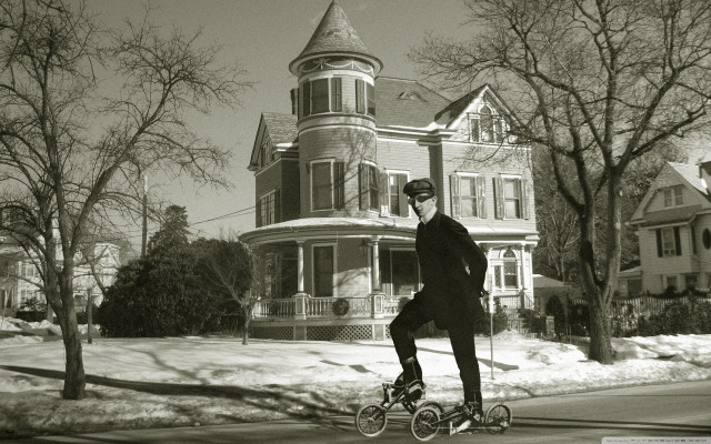 Man riding bike street tall free wallpaper for desktop - medium preview image