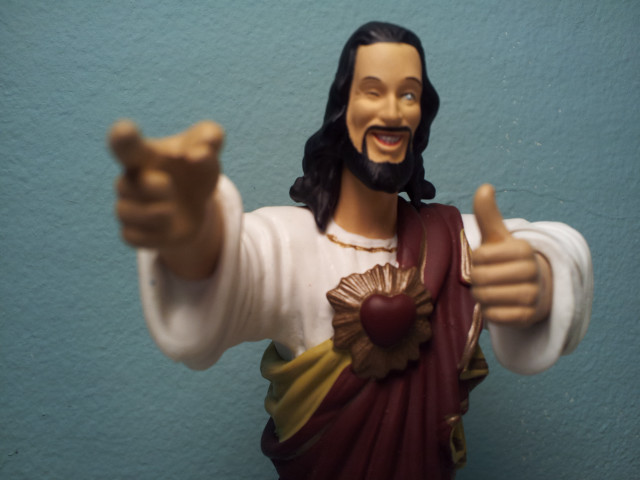 Jesus statue pointing smiling chest free wallpaper for desktop - medium preview image