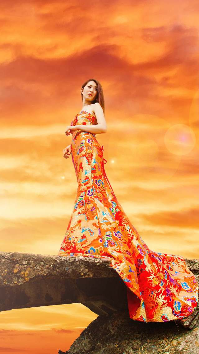 Woman long dress rock sunset #2 free wallpaper for mobile - medium preview image