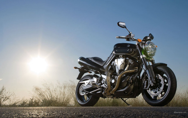 Motorcycle parked road sun sky free wallpaper for desktop - medium preview image