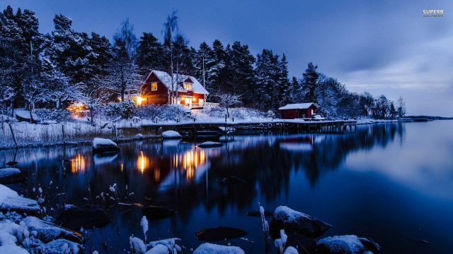 Snowy night lake house fireworks free wallpaper for desktop - medium preview image