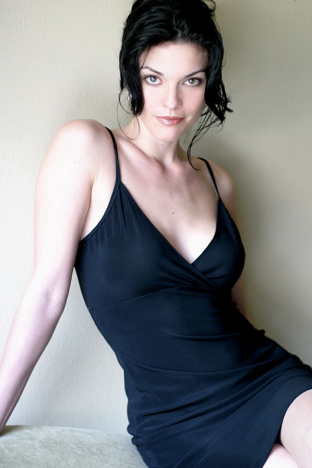 Woman black dress posing bed free wallpaper for mobile - medium preview image