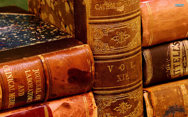 Old books stack table wall free wallpaper for desktop - medium preview image