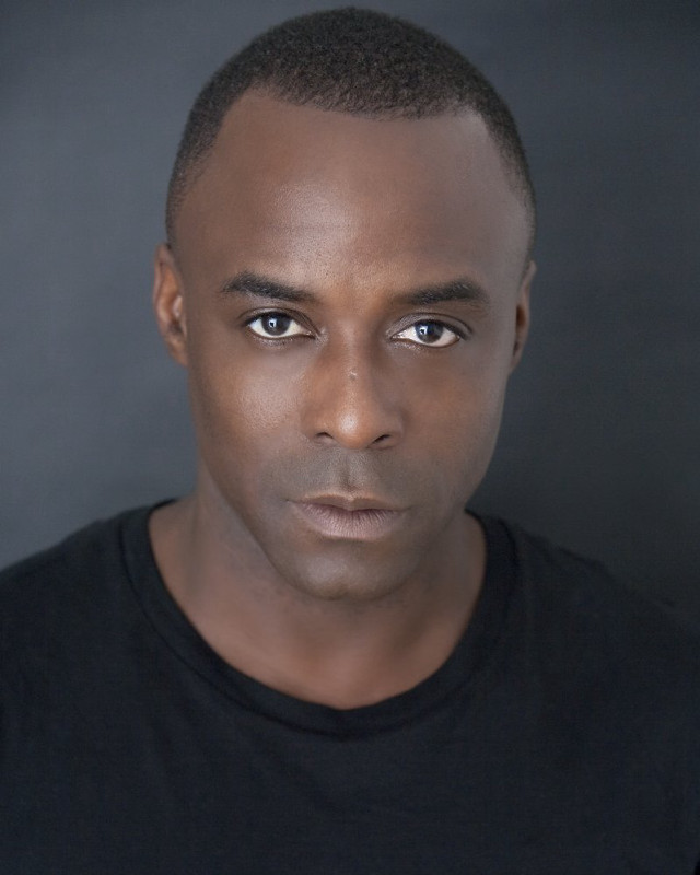 Man black shirt serious look #2 free wallpaper for mobile - medium preview image