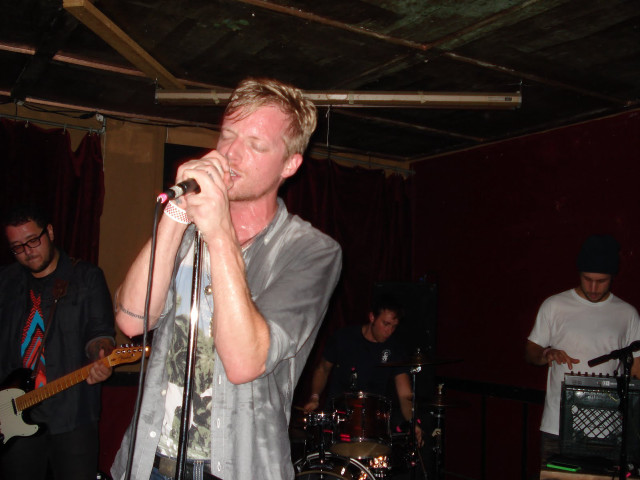 Man singing microphone band stage free wallpaper for desktop - medium preview image