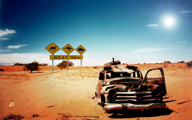 Rusted car desert road sign free wallpaper for desktop - medium preview image