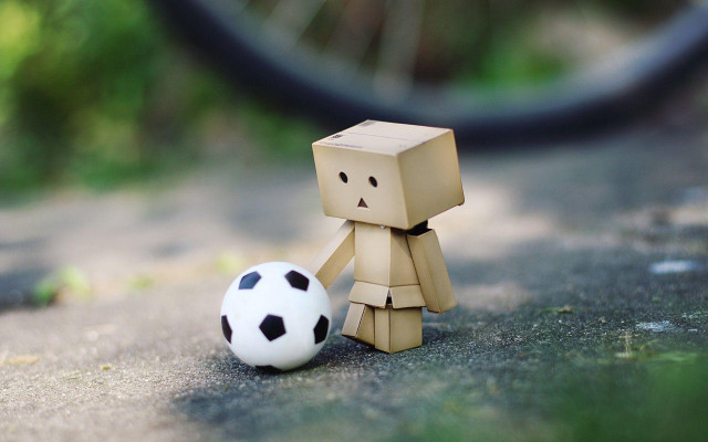 Toy soccerball bike blurry checkered free wallpaper for desktop - medium preview image