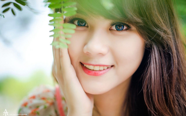 Woman blue eyes green leaf #4 free wallpaper for desktop - medium preview image