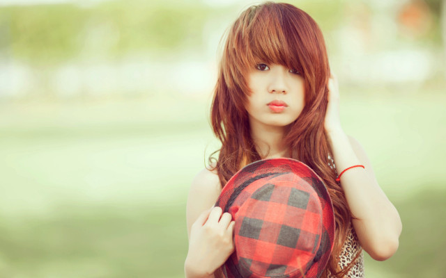 Woman holding hat posing picture free wallpaper for desktop - medium preview image