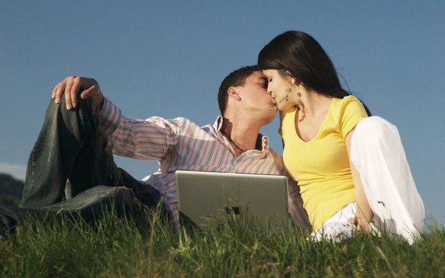 Man woman sitting grass laptop free wallpaper for desktop - medium preview image