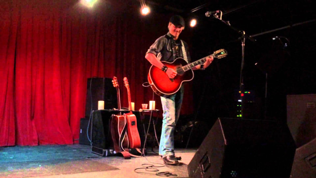 Man stage guitar microphone performance free wallpaper for desktop - medium preview image