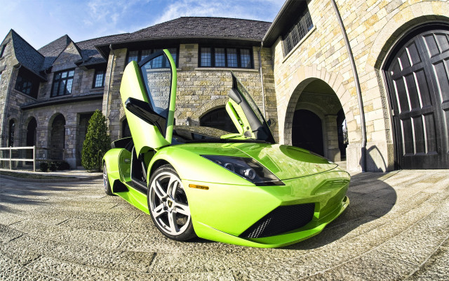 Green sports car parked house free wallpaper for desktop - medium preview image