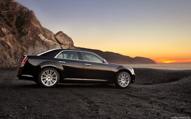 Black car rocky beach sunset free wallpaper for desktop - medium preview image