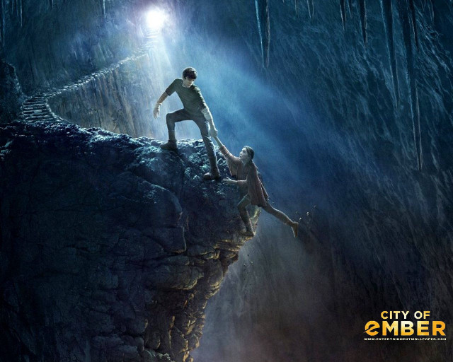 Man woman climbing cliff cave free wallpaper for desktop - medium preview image