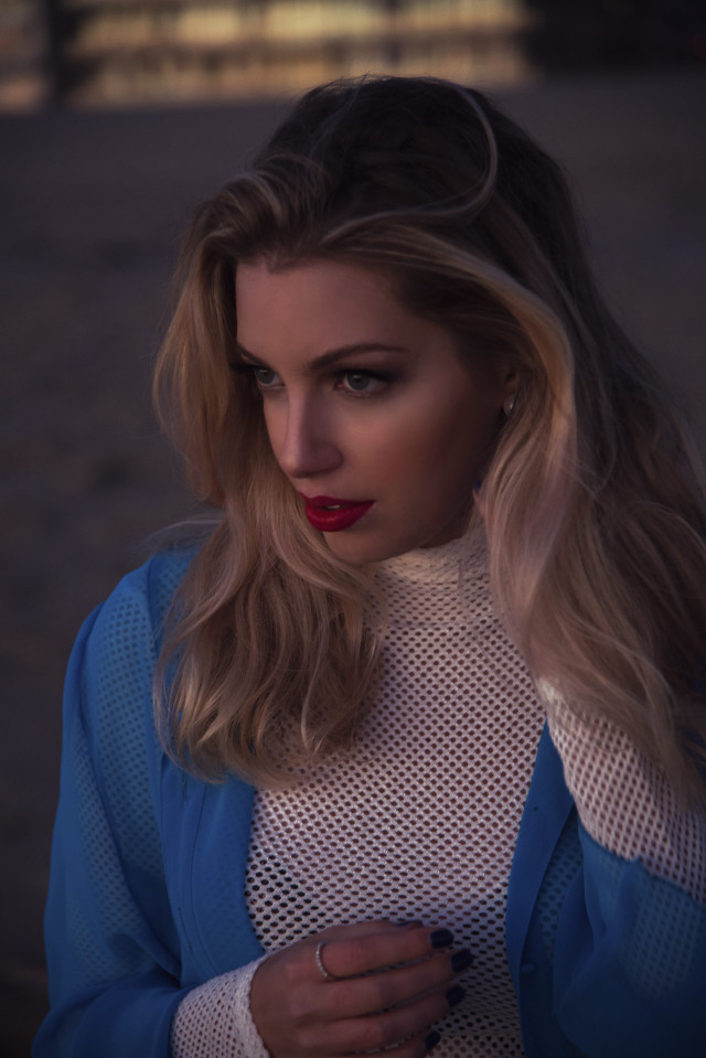 Woman long hair blue jacket free wallpaper for mobile - medium preview image