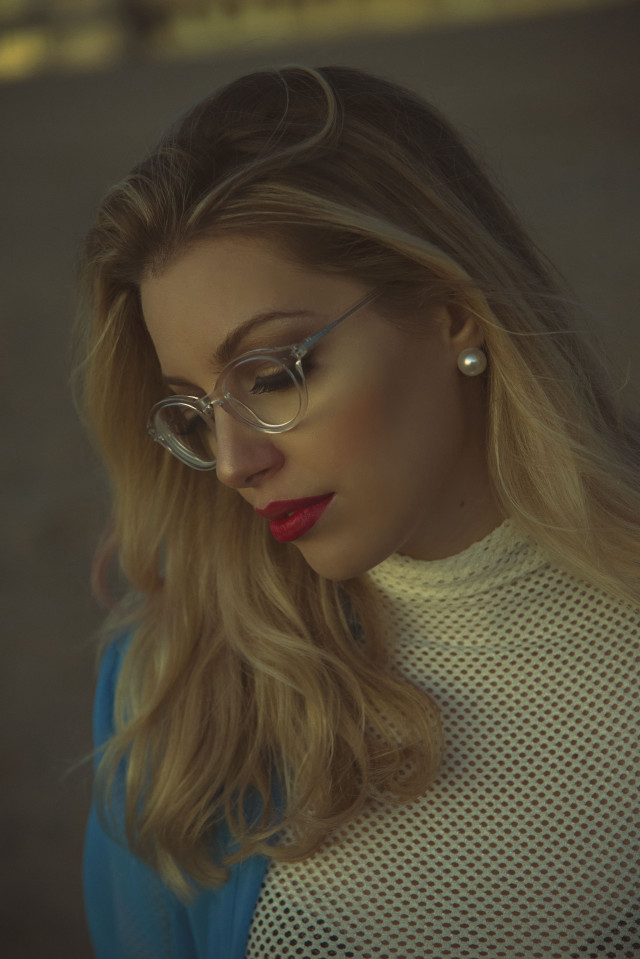 Woman glasses sweater cellphone outside free wallpaper for mobile - medium preview image