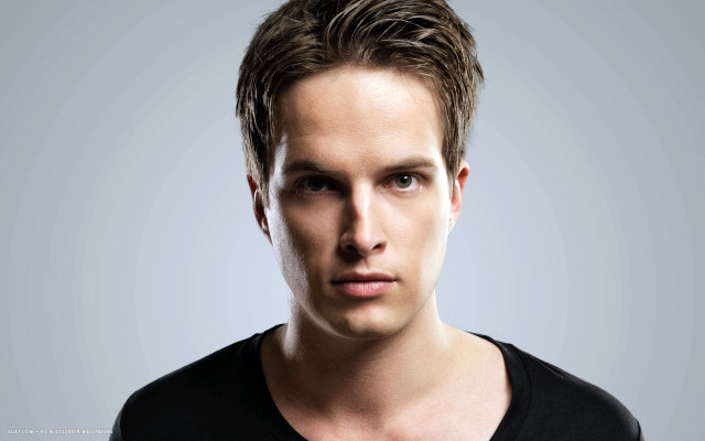 Man black shirt gray background free wallpaper for desktop - medium preview image