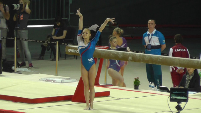 Woman blue leotard beam trick free wallpaper for desktop - medium preview image