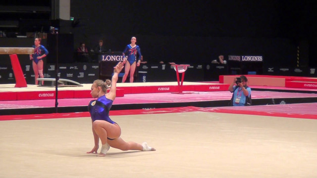 Woman blue leotard balance beam free wallpaper for desktop - medium preview image
