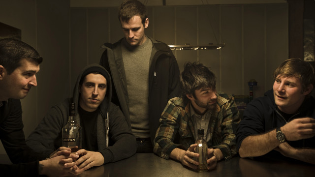 Men sitting table beer bottles #2 free wallpaper for desktop - medium preview image