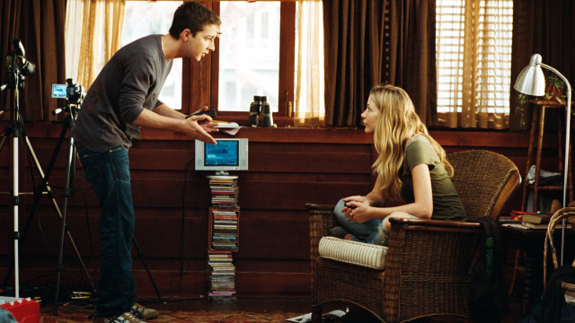 Man woman chair room books free wallpaper for desktop - medium preview image