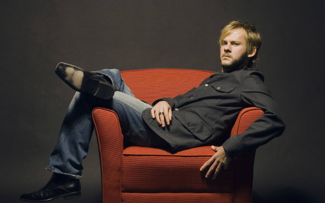 Man sitting red chair legs free wallpaper for desktop - medium preview image