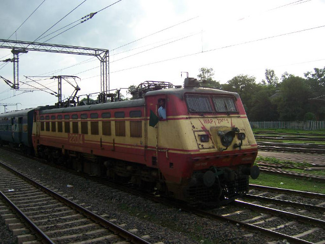 Train traveling tracks field grass free wallpaper for desktop - medium preview image
