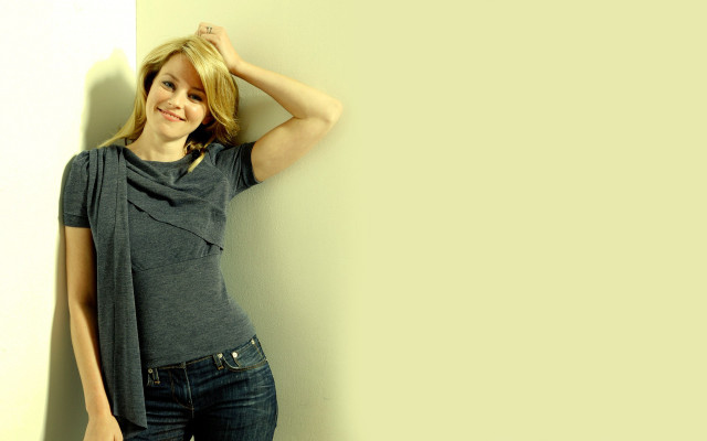 Woman leaning wall hand smile free wallpaper for desktop - medium preview image