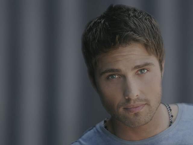 Man blue shirt necklace serious free wallpaper for desktop - medium preview image