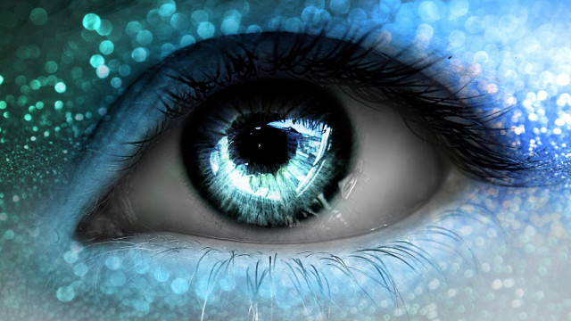 Blue eye closeup blurry background free wallpaper for desktop - medium preview image