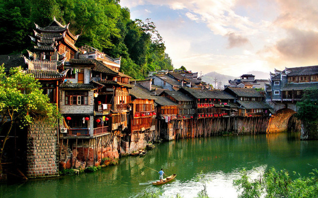 River buildings man boat scenery free wallpaper for desktop - medium preview image