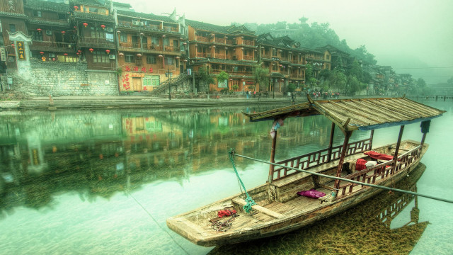 Boat docked village river buildings free wallpaper for desktop - medium preview image