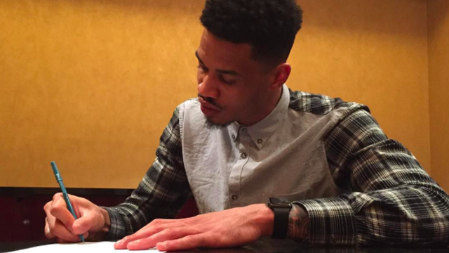 Man sitting table writing pen free wallpaper for desktop - medium preview image