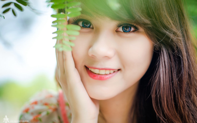 Woman blue eyes green leaf free wallpaper for desktop - medium preview image