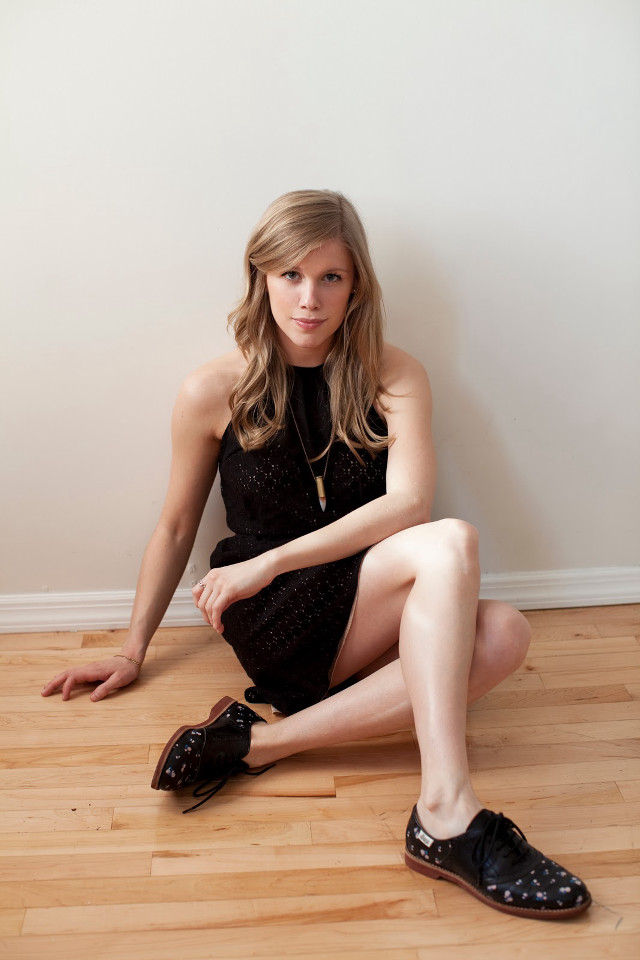 Woman black dress shoes sitting free wallpaper for mobile - medium preview image